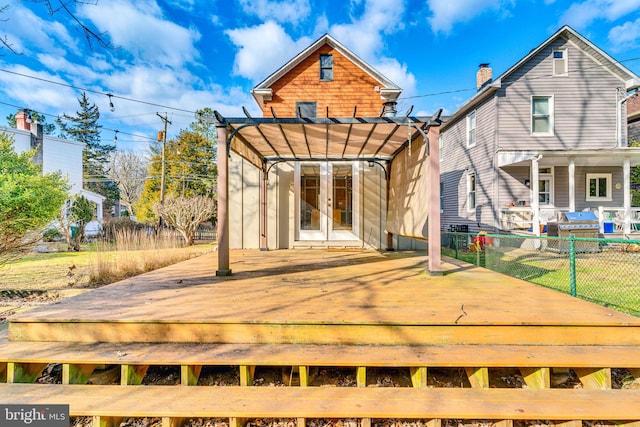 wooden terrace with french doors and a pergola