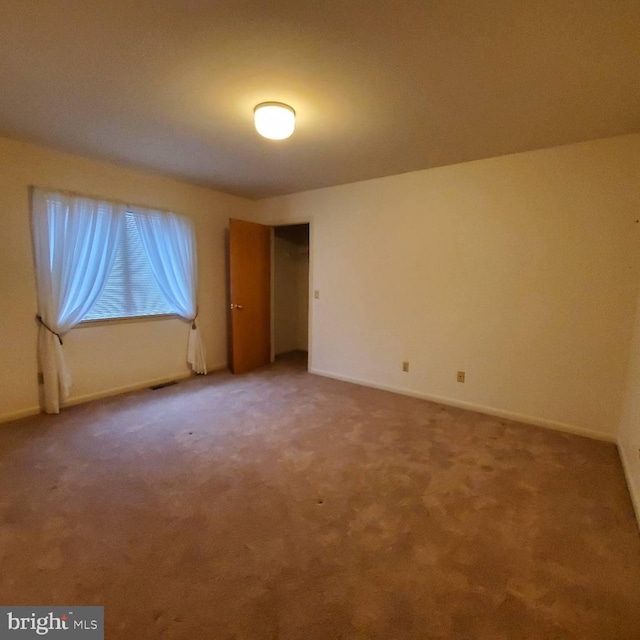 spare room featuring carpet flooring