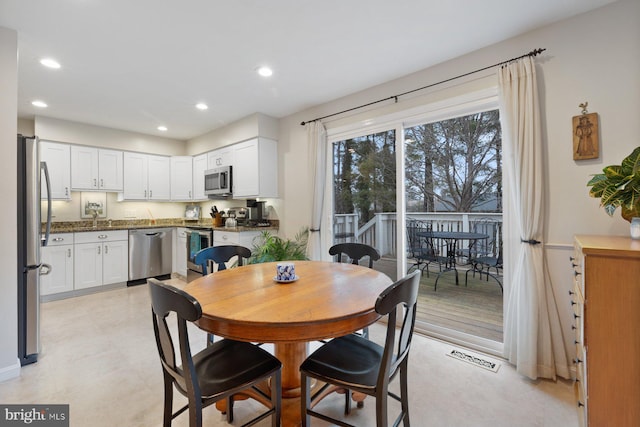 dining room featuring sink