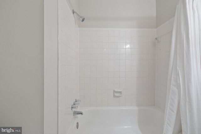 bathroom featuring shower / bathtub combination with curtain