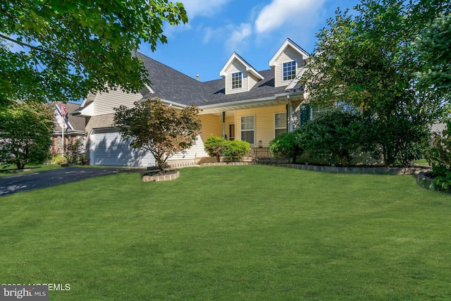 cape cod house with a front lawn