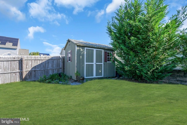 view of outbuilding with a lawn