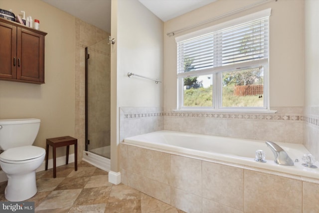 bathroom featuring independent shower and bath and toilet