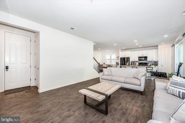 living room featuring dark wood-type flooring