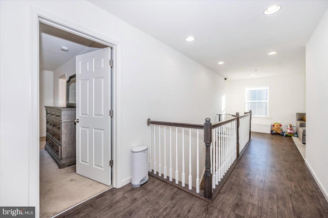 hall with dark hardwood / wood-style flooring