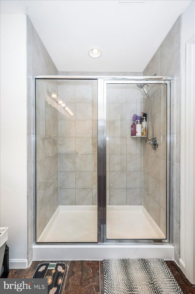 bathroom with an enclosed shower