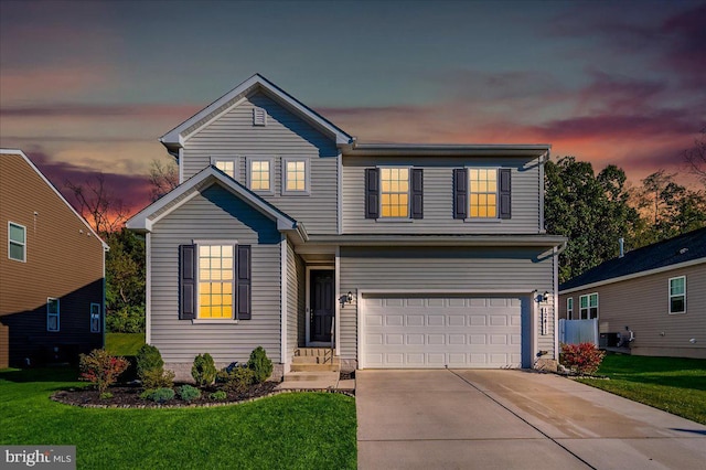 front facade with a lawn and a garage