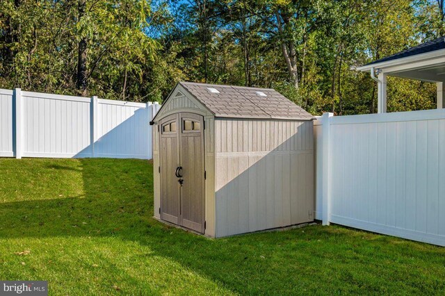 view of outdoor structure featuring a lawn