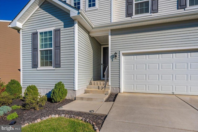 doorway to property featuring a garage