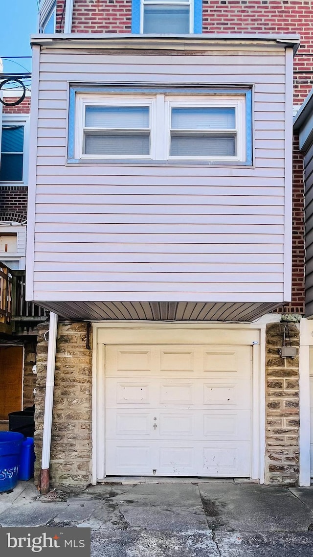 view of property exterior with a garage