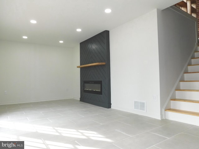 unfurnished living room with a fireplace