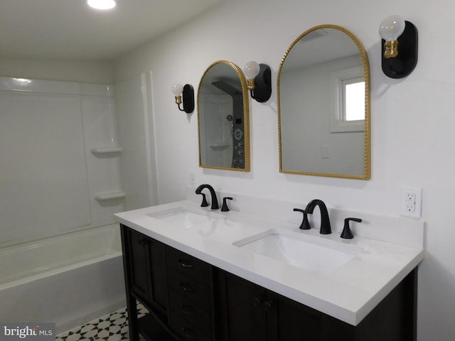 bathroom with vanity and bathing tub / shower combination