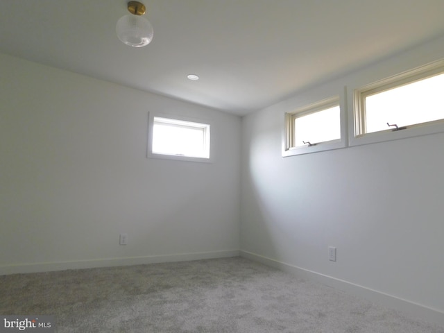 unfurnished room featuring carpet