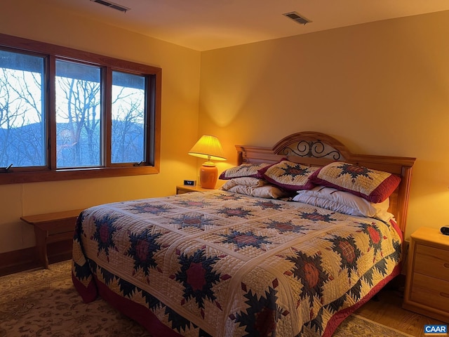 bedroom featuring hardwood / wood-style floors