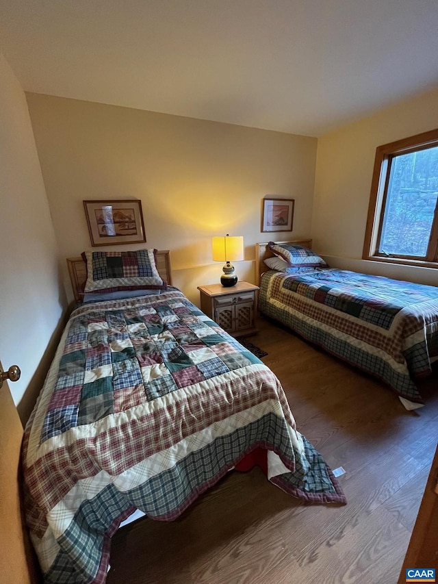 bedroom with wood-type flooring