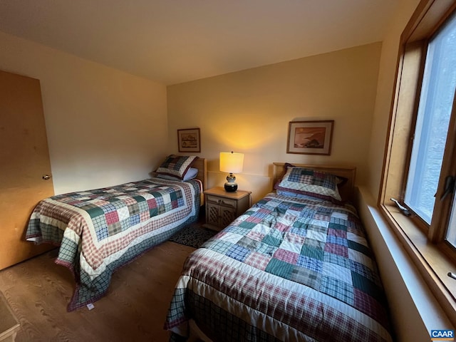 bedroom with hardwood / wood-style flooring