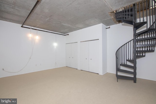 basement featuring carpet flooring