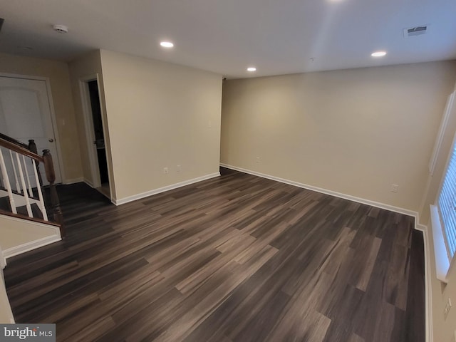 empty room featuring dark hardwood / wood-style flooring