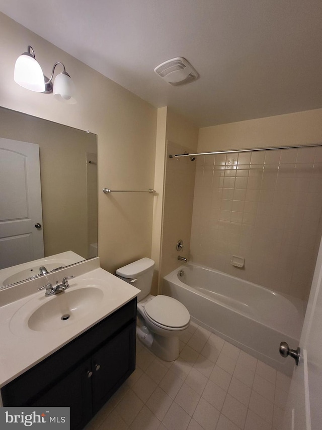 full bathroom featuring tile patterned floors, vanity,  shower combination, and toilet