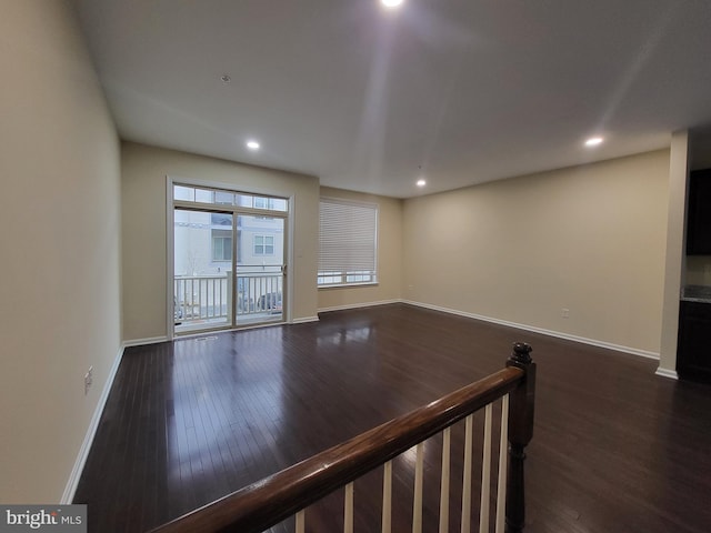 unfurnished room featuring dark hardwood / wood-style floors