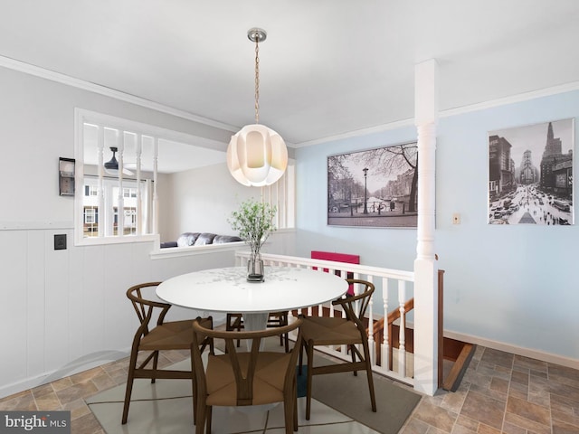 dining space featuring ornamental molding