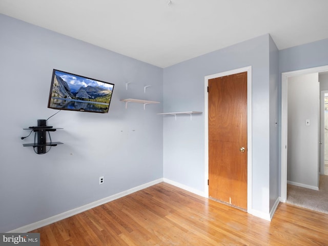 unfurnished bedroom with light hardwood / wood-style floors