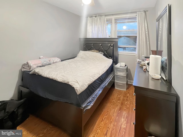 bedroom featuring ceiling fan and light wood-type flooring