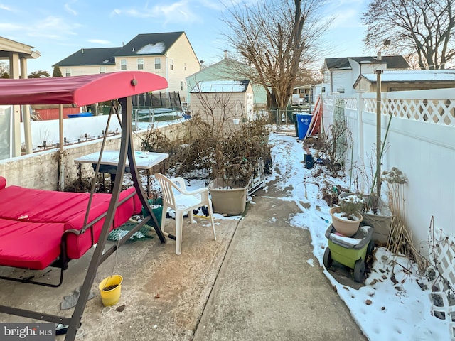 view of yard covered in snow