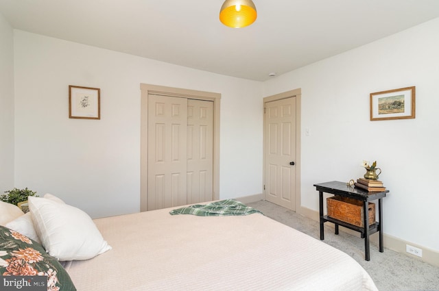 carpeted bedroom with a closet