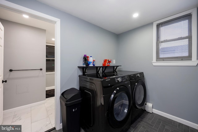 laundry room with laundry area, recessed lighting, baseboards, and washing machine and clothes dryer