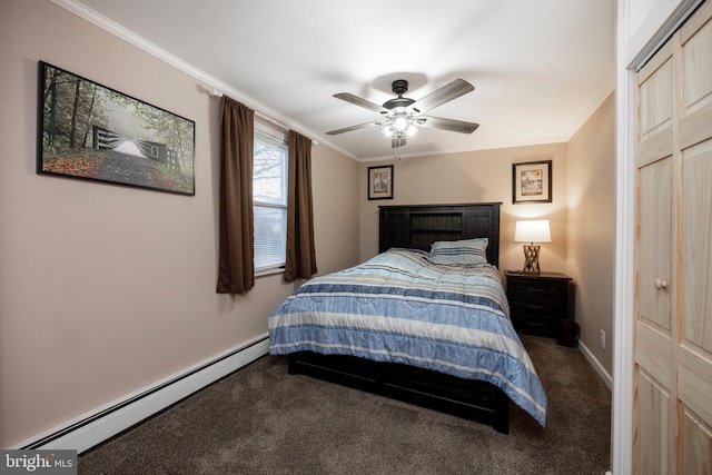 bedroom featuring a baseboard heating unit, crown molding, and carpet floors