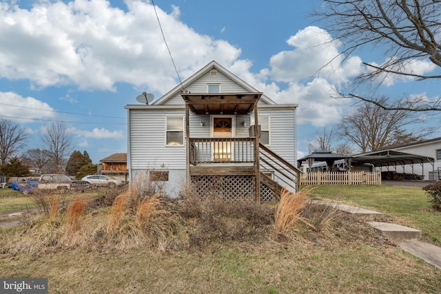 rear view of property featuring a carport