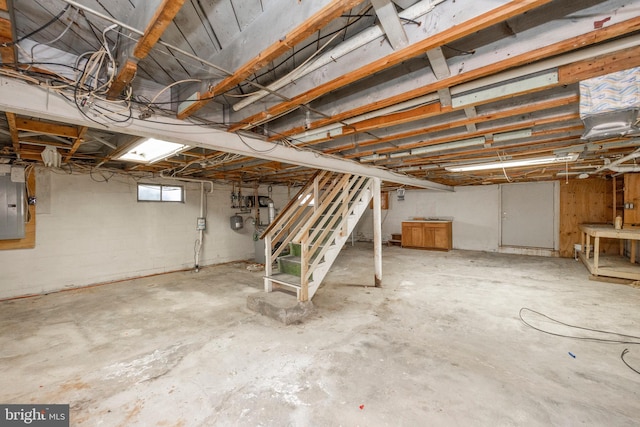 basement featuring electric panel and stairs