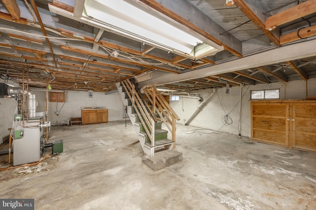 unfinished basement with a heating unit