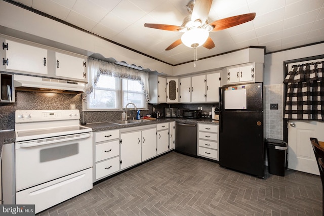 kitchen featuring dark countertops, under cabinet range hood, dishwasher, freestanding refrigerator, and white range with electric stovetop