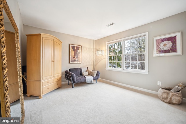 living area featuring light colored carpet