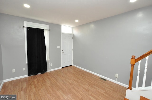 spare room with light wood-type flooring