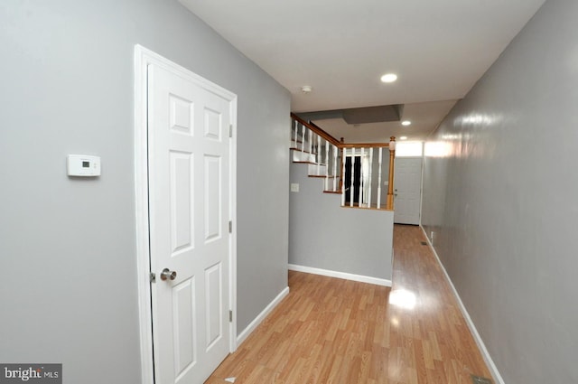 hall with light hardwood / wood-style flooring