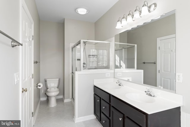 bathroom featuring toilet, walk in shower, tile patterned flooring, and vanity