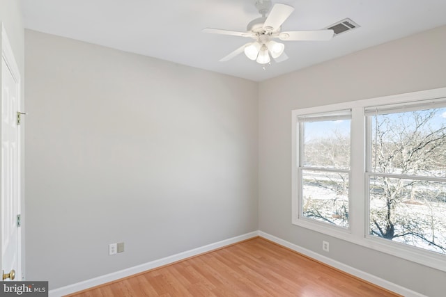 spare room with ceiling fan and light hardwood / wood-style floors