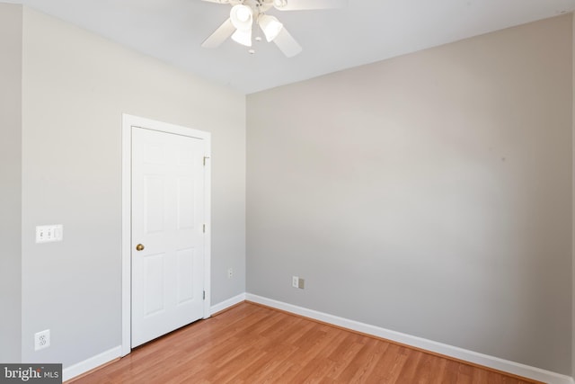 spare room featuring wood-type flooring and ceiling fan