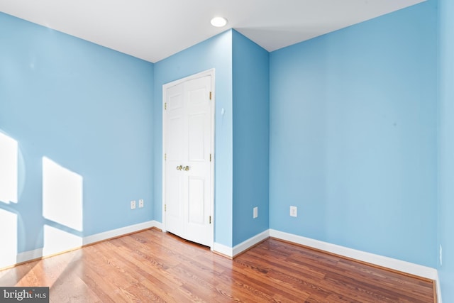 unfurnished room featuring wood-type flooring