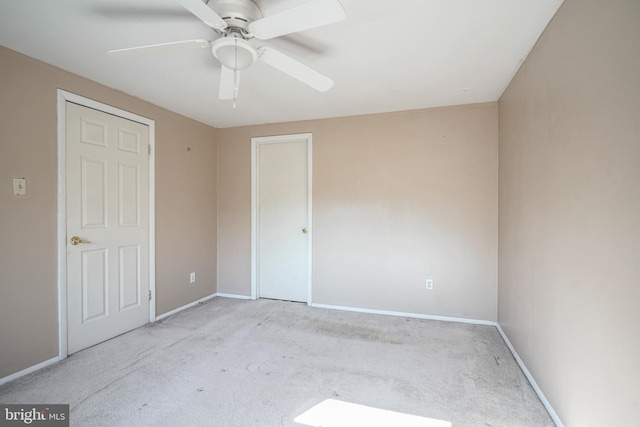 unfurnished bedroom with ceiling fan and light carpet