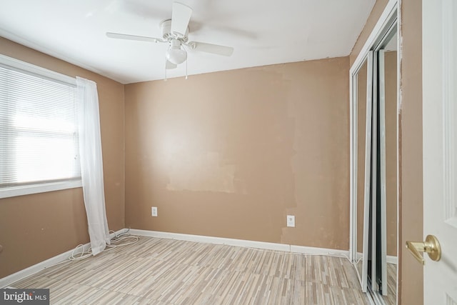 unfurnished room with ceiling fan