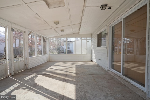 unfurnished sunroom with a wealth of natural light