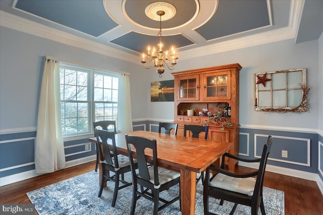 dining area featuring crown molding, coffered ceiling, dark hardwood / wood-style floors, and an inviting chandelier