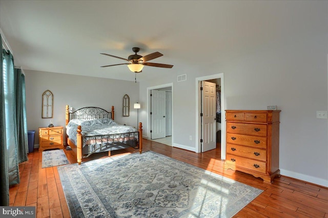 bedroom with ceiling fan and hardwood / wood-style floors