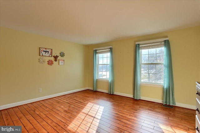 unfurnished room featuring light hardwood / wood-style flooring