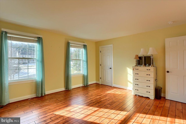 unfurnished room with light hardwood / wood-style flooring