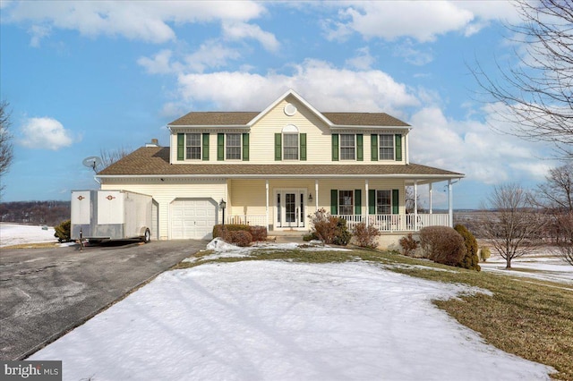 view of front facade featuring a porch and a garage